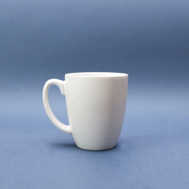 White ceramic mug against a soft blue background